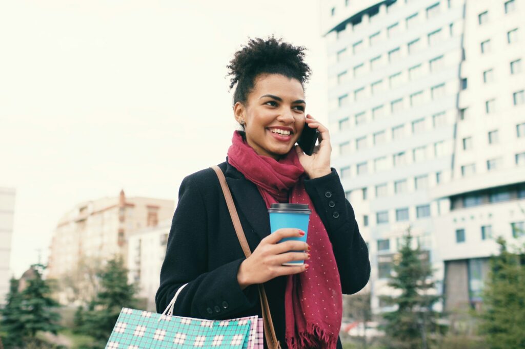 Traveler using mobile connectivity abroad through eSIM technology to stay connected safely and affordably.