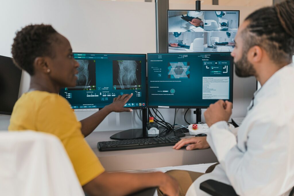 Two doctors looking at medical displays